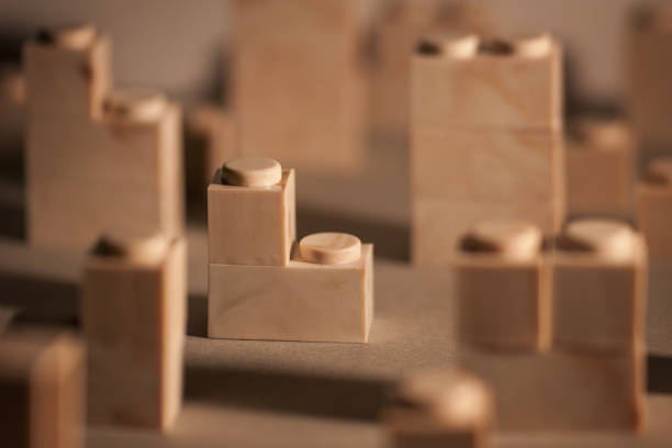 istock Selective focus of brown, wooden building blocks 1437640788