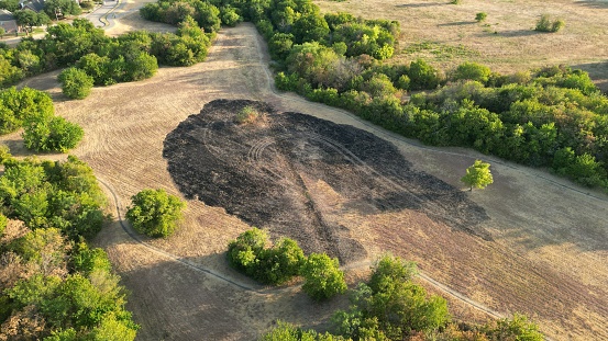 An aerial view of a rural field with bushes in Texas