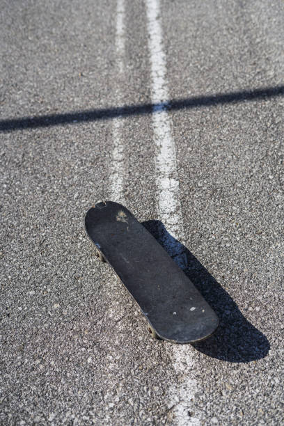 istock Vertical shot of skateboard in the road 1437641177