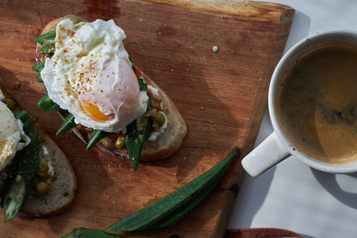Delicious Brunch Toast, topped with fresh okra and poached egg