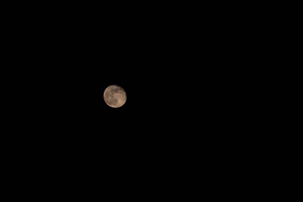 A wallpaper with full moon in the dark sky
