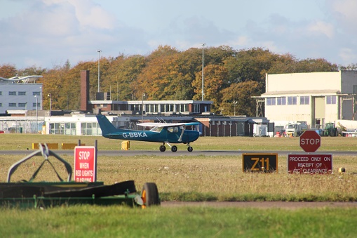 Doncaster, United Kingdom – October 28, 2019: Cessna 150 light aircraft taxiing at Doncaster Sheffield Airport, South Yorkshire, England