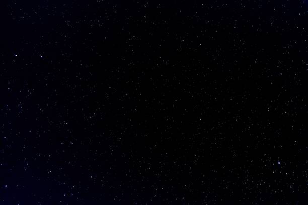 istock Starry sky at night - perfect for wallpapers and backgrounds 1437644651
