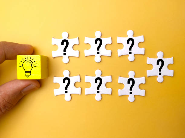 istock Hand holding wooden cube with a question icon and a light bulb. Concept idea 1437644755