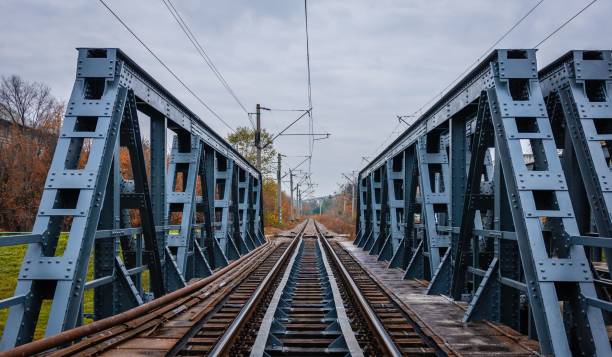 istock Closeup of a long train railway between blue metal track frames 1437645554