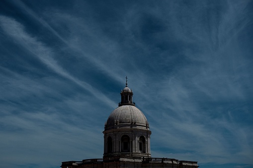 The close-up view of the National Pantheon's top with the blue sky in the background