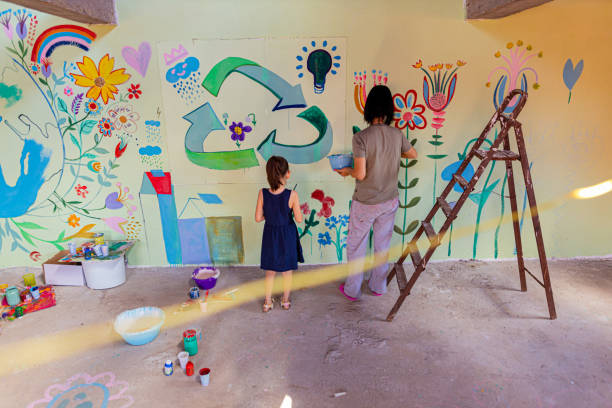 istock Daughter and mother creating a mural 1437646952