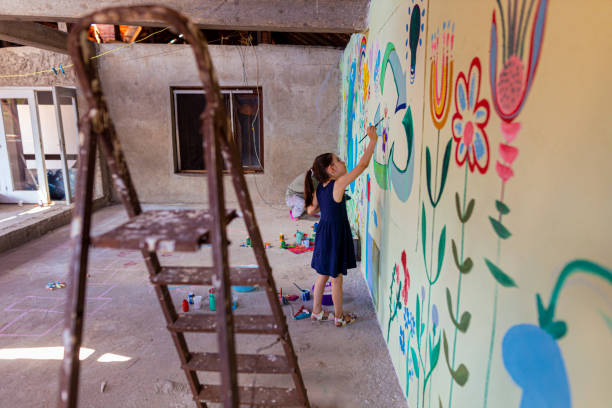 istock A little girl creating a mural 1437647017
