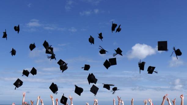 istock Graduation caps in the air during the graduation celebration 1437647033