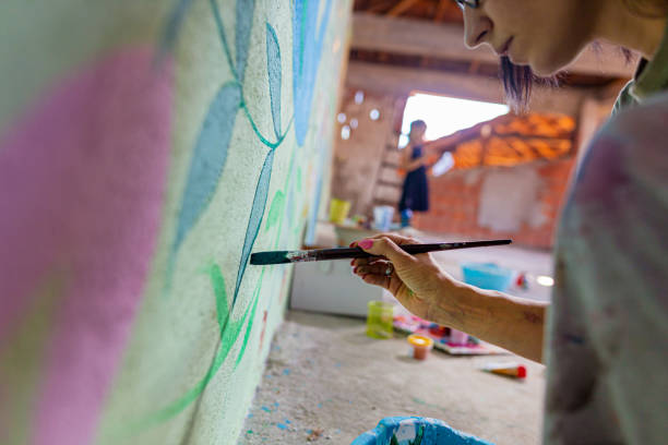istock Painting plant ornaments on the wall 1437647068