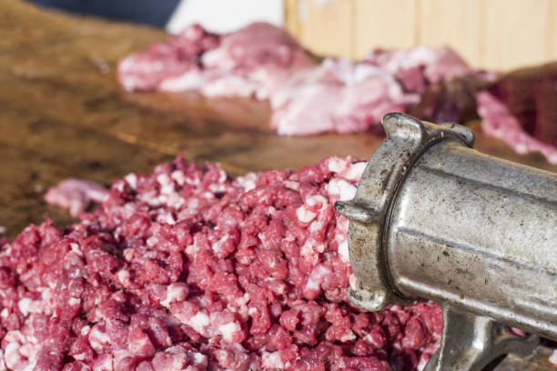 istock Iron meat grinder grinding beef in the kitchen 1437647098