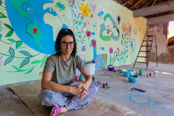 istock Young intelligent artist and her mural 1437647389