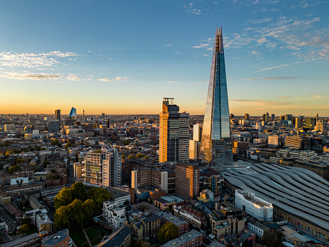 Sunset aerial view of London cityscape including the iconic Shard building.