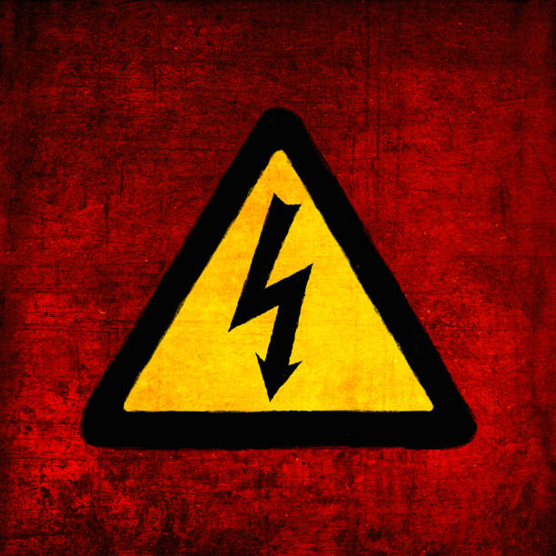High voltage sign, yellow and black on red. Electrical hazard emblem, grunge textured