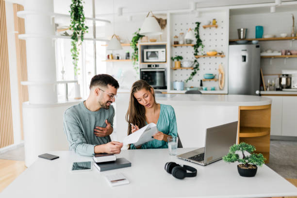 istock Young couple working at home 1437655135