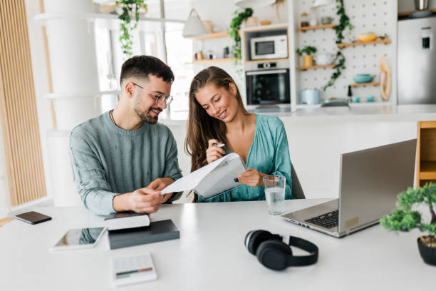 istock Young couple working at home 1437655173