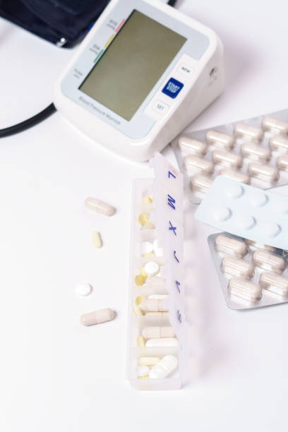 istock daily pill box with blood pressure device 1437656365