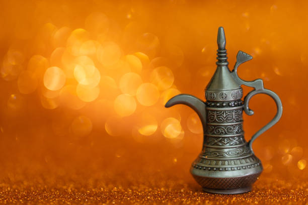 Shiny silver Arabian Dallah coffee pot with curved spout and ornate handle, isolated on a transparent background. Perfect for Middle Eastern cultural, hospitality, or culinary visuals. silver dallah, Arabian coffee pot, Islamic teapot, traditional Arabic kettle, Middle Eastern decor, Muslim hospitality, isolated coffee pot, transparent background object, Arabic metalware, vintage coffee pot, Ramadan tea service, Eid coffee pot, Gulf traditional kettle, Arabian culture, Islamic tea set, Middle East kitchenware, polished metal pot, silver tea kettle, Arabic traditions, old fashioned teapot