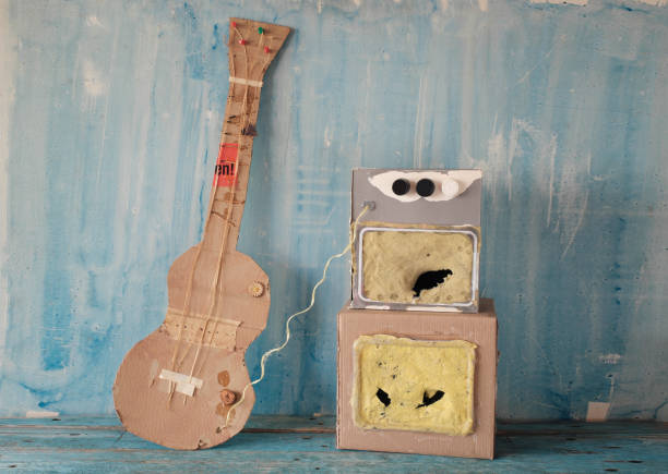 Grungy cardboard model of a guitar and an amp stack,music, live performance, grunge rock concept stock photo