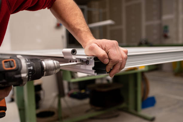 istock Male with a red shirt making a window with industrial tools 1437666736