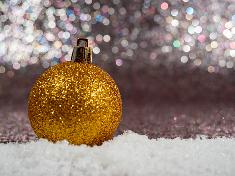 Golden Christmas decoration made of balls and light.