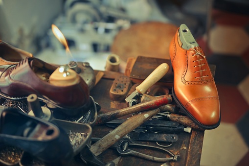 A closeup shot of the beautiful handmade shoes in the workshop