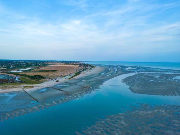 istock Drone view of a tranquil blue sea with a sandy shore under a clear blue sky 1437668248