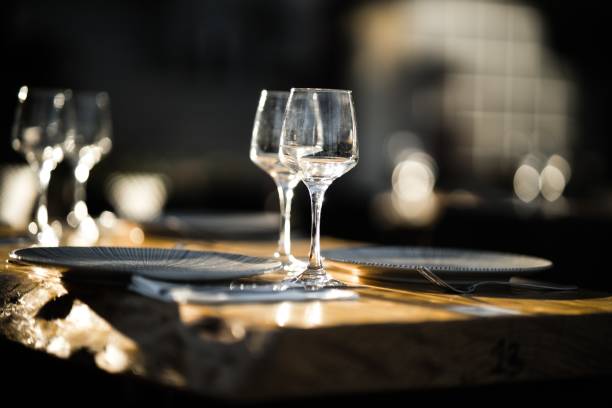 istock Selective focus shot of table setting with wine glasses and plates 1437668938