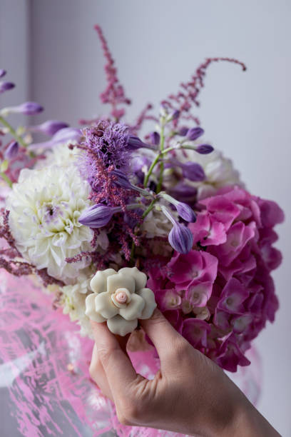 istock Girl preparing flowers for bouquet. 1437669552