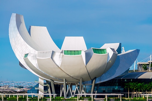 Singapore, Singapore – May 10, 2014: Singapore, May 2014: view on the lotus flower architecture of the ArtScience Museum on a clear blue sky