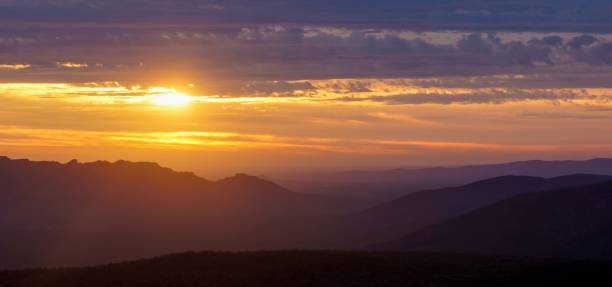 istock Mesmerizing view of a golden sunset over mountains 1437671240