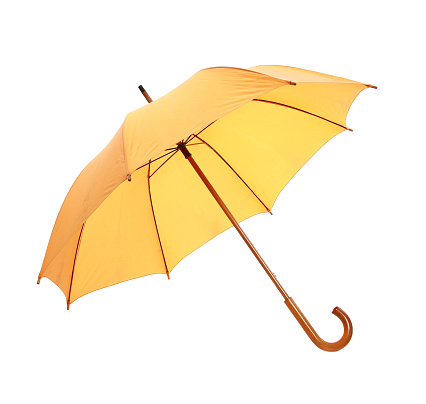 A closeup shot of yellow umbrella isolated on white background