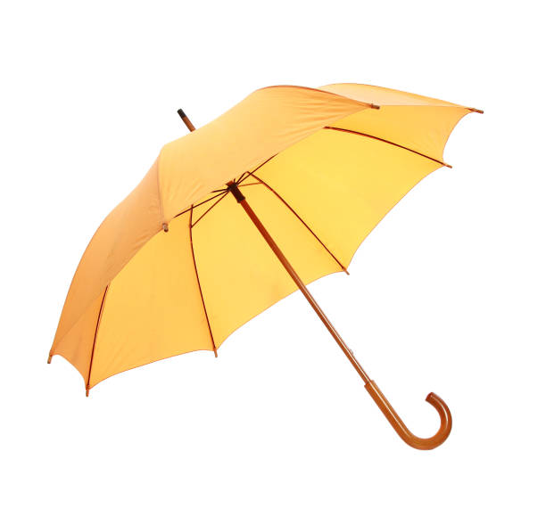 zbliżenie żółtego parasola izolowanego na białym tle - decorative umbrella zdjęcia i obrazy z banku zdjęć