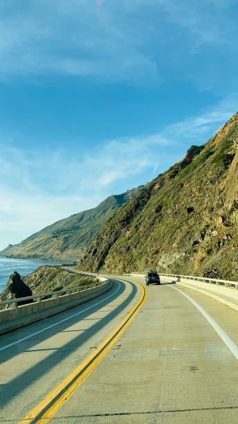 istock Beautiful view of the empty highway along with autumn trees under sunlight 1437671400