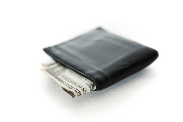 istock Black wallet with cash dollar isolated on white background 1437671411