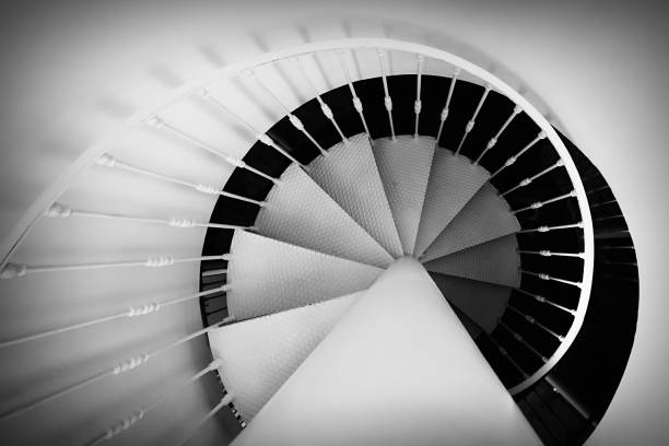 istock White and black spiral staircase 1437672283