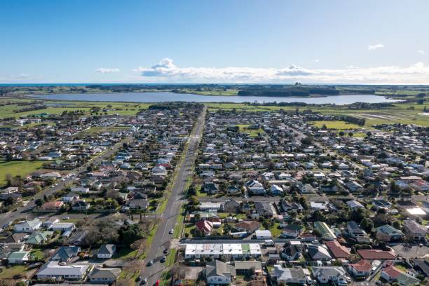 Levin looking west to lake Aerial shot of Levin looking west along queen Street towards Lake Horowhenua and in the distance the Tasman Sea. Small town in New zealand manawatu stock pictures, royalty-free photos & images