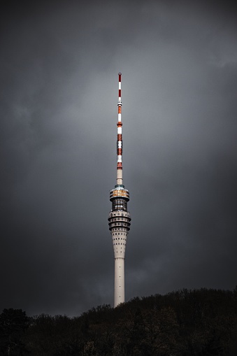A vertical shot of the Television Tower against a cloudy sky in Dresden, Germany