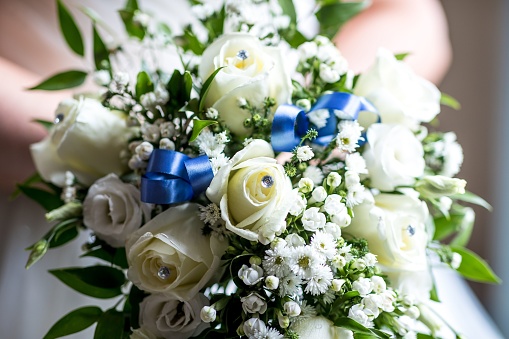 A closeup of a beautiful bouquet of white roses for a wedding