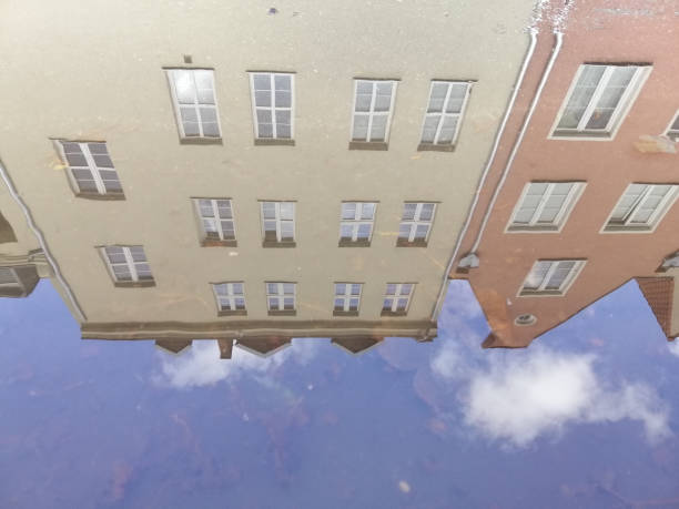 istock A mirror street puddle with a beautiful typical building reflection in Gdansk, Poland 1437672812