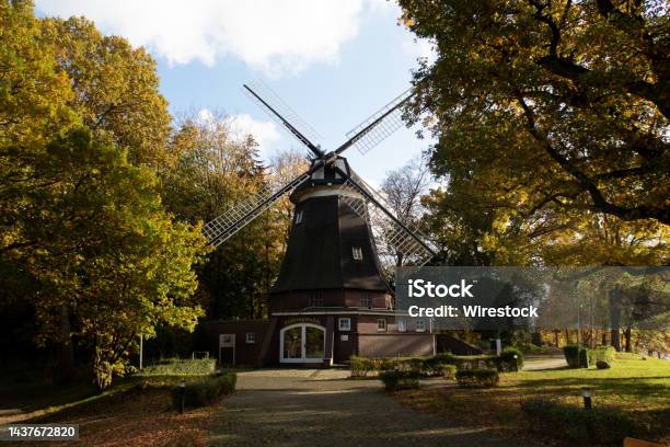 Old Windmill Surrounded By Lush Vegetation In Meppen Emsland Germany Stock Photo - Download Image Now