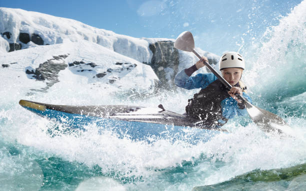 istock Woman in a kayak sails on a mountain river 1437673875