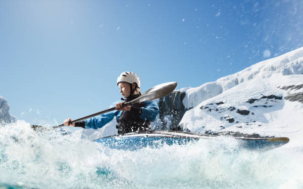 istock Woman in a kayak sails on a mountain river 1437673876