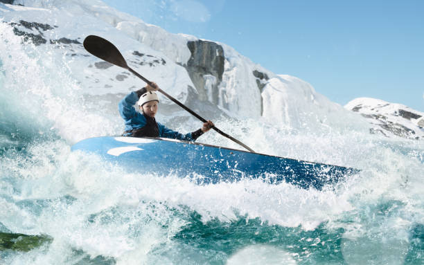 istock Woman in a kayak sails on a mountain river 1437673896