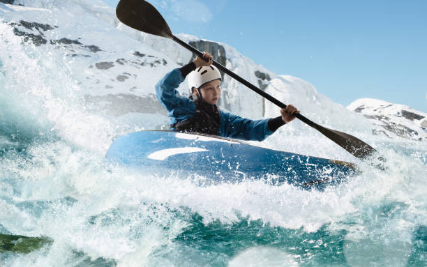 istock Woman in a kayak sails on a mountain river 1437673912