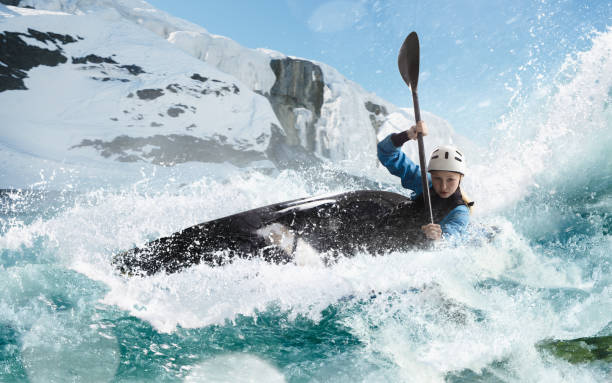 istock Woman in a kayak sails on a mountain river 1437673913