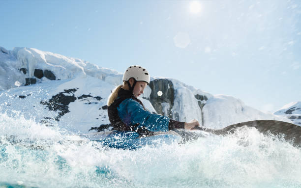 istock Woman in a kayak sails on a mountain river 1437673941