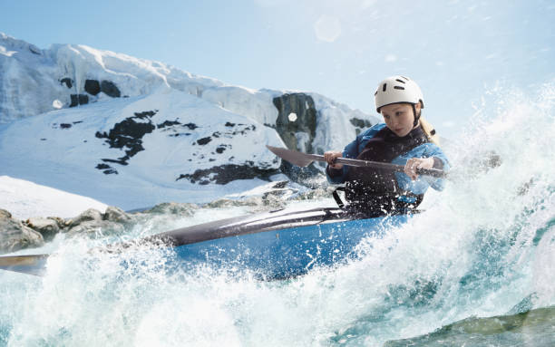 istock Woman in a kayak sails on a mountain river 1437673950