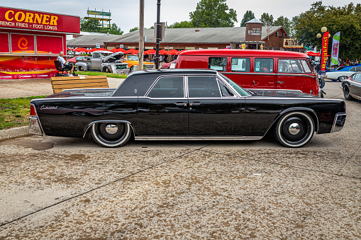 Des Moines, IA - July 01, 2022: High perspective side view of a 1963 Lincoln Continental 4 Door Sedan at a local car show.