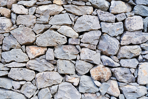 Flat stacked stone wall.